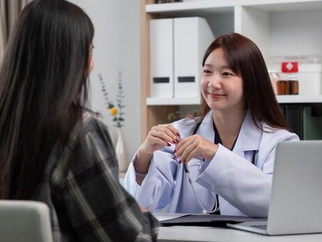 Friendly doctor consulting with a patient about general healthcare